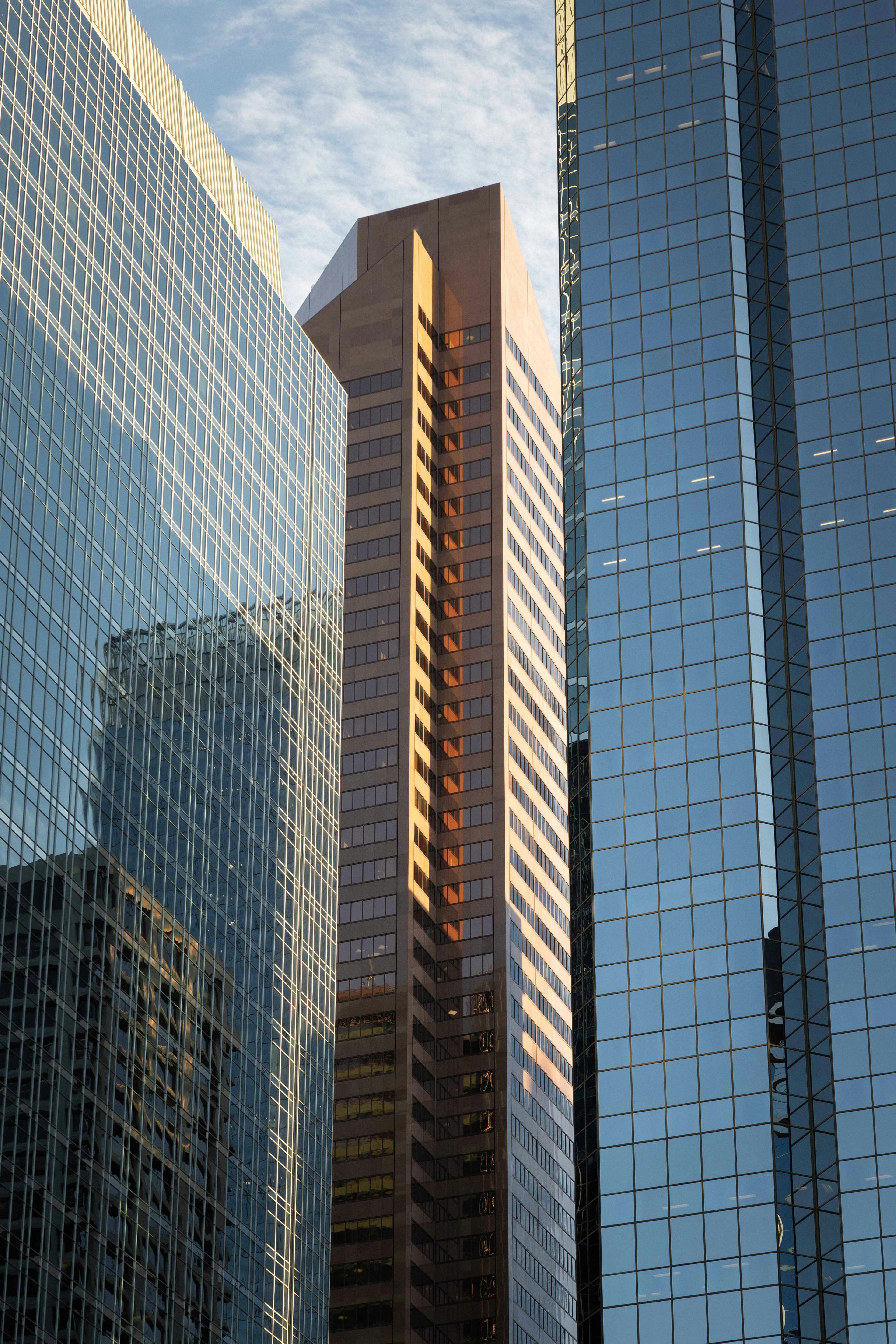 Glass office towers with warm golden hour reflections
